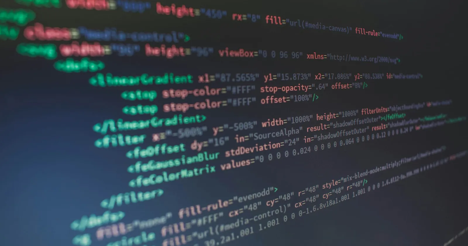 An abstract, closeup image of code in a code editor that is blurred